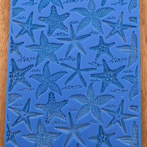 Blue silicone mold with starfish designs.
