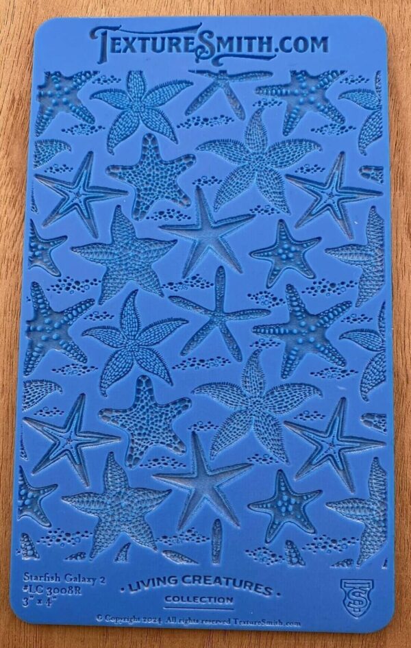 Blue silicone mold with starfish designs.