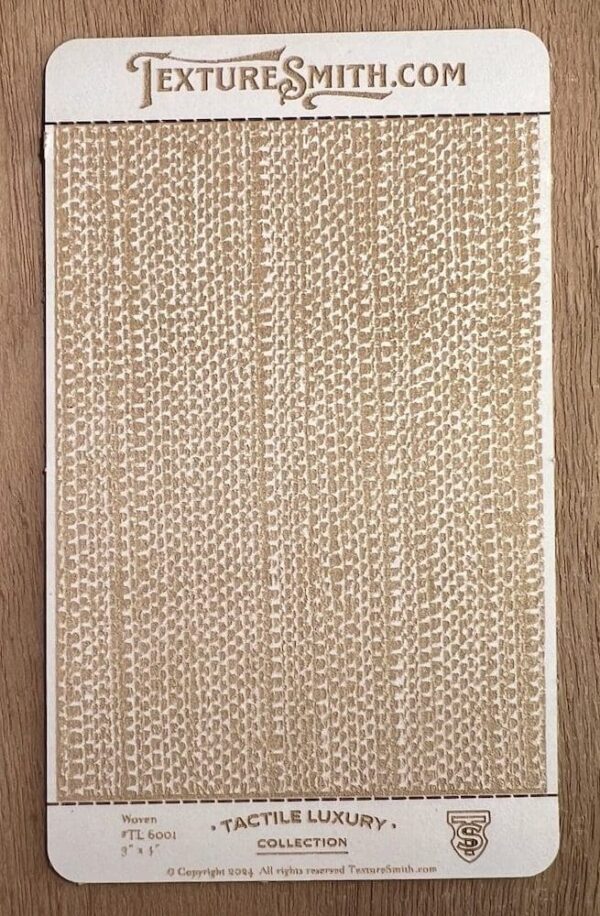 Close-up of a textured beige woven rug on a wooden floor.