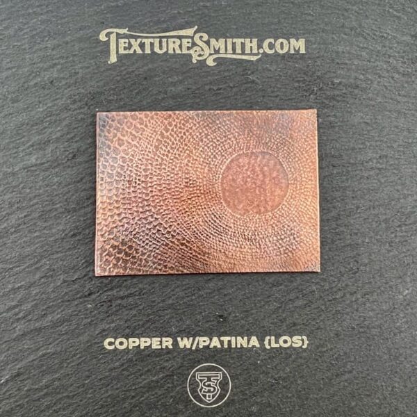 Copper sheet with patina finish showcasing texture.