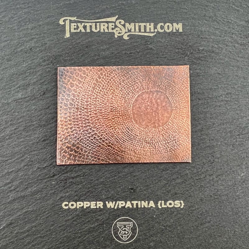 Copper sheet with patina finish showcasing texture.