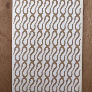 A patterned fabric with a repeating wavy design in brown and beige.